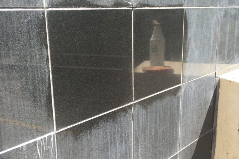 Stone facade surface preparation before protective coating