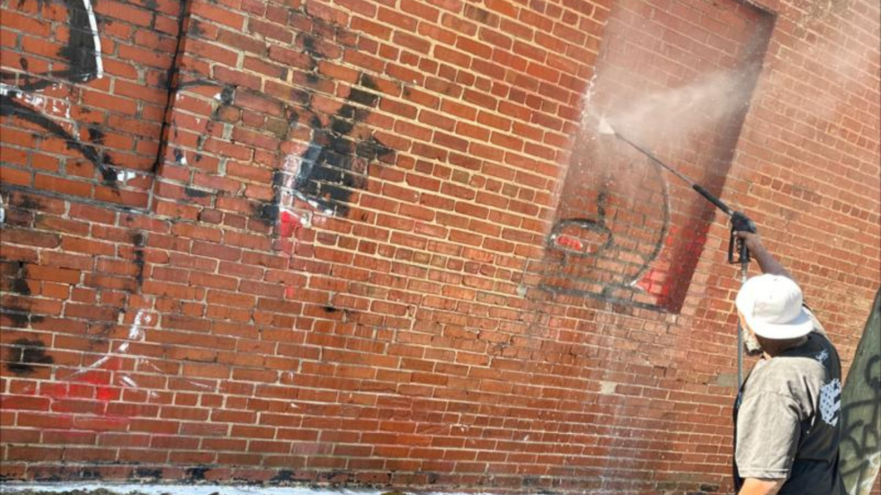 Industrial graffiti removal from brick building Bay Area
